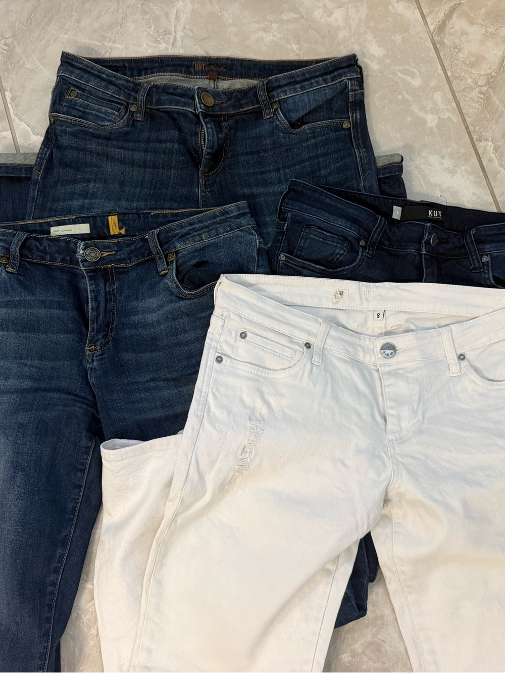 Women’s KUT jeans. 4 pair bundle. Three denim and one white.